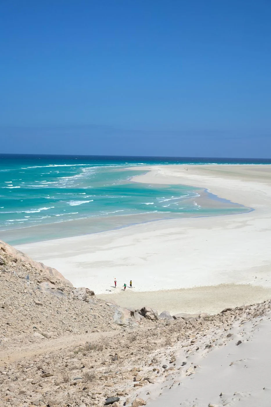 White sand and turquoise waves along the coast